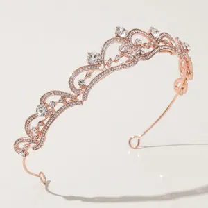 Elegant rose gold bridal tiara with sparkling rhinestones and ornate scroll patterns