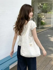 Large capacity striped canvas tote bag for women showing casual outdoor shoulder wear