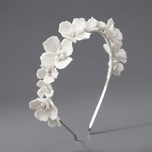 Elegant white ceramic flower headband with pearls and silver metal frame for brides