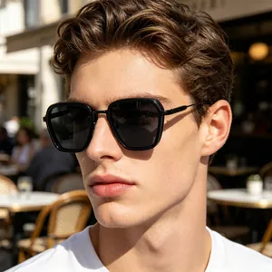 Close-up of stylish men's square sunglasses with premium metal temples on a model