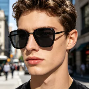 Close-up of men's square sunglasses with black frame and slim metal temples on model