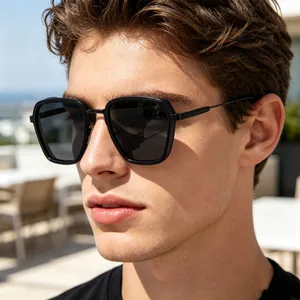 Close-up of premium men's square sunglasses with glossy black frames and metal temple details