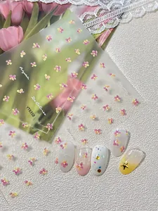 Detail view of floral nail stickers YT8358 with pink petals on false nails
