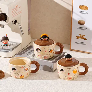 Detail of cute ceramic rabbit mug with cartoon illustration and creative ball handle