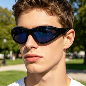 Close-up of Y2K wraparound sunglasses with black frames and blue mirrored lenses on a model