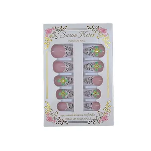 French almond press-on nails with zebra patterns and floral accents in pink and white