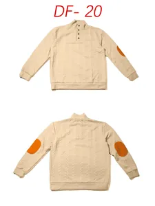 Detail of cable knit sweater with half-button collar and elbow patch accents