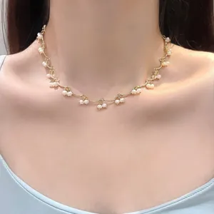 Elegant gold wave chain necklace with freshwater pearl fringe tassels for women