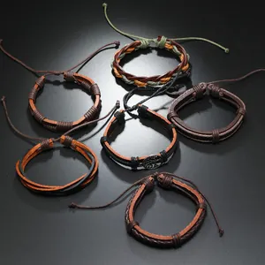 Detailed view of multilayer leather bracelets set featuring tree of life charms