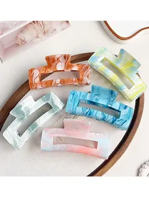 Detailed set of five marble pattern acrylic hair claws in assorted vibrant colors