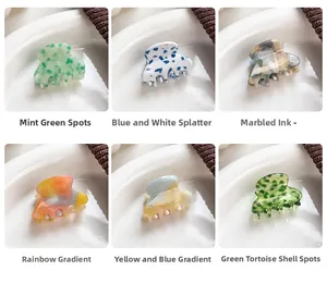 Mini acetate hair claw clips in six colorful patterns with elegant marble texture