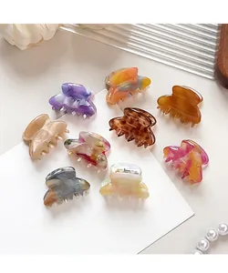 Set of nine assorted acetate hair claws with marble and tortoiseshell patterns