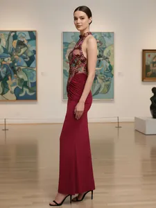 Elegant burgundy halter neck evening gown with sequin floral embroidery and pleats