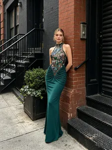 Elegant emerald green halter neck mermaid dress with floral sequin embroidery detail