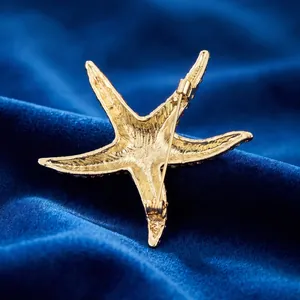 Back view of a gold alloy starfish brooch with high-quality metal casting texture