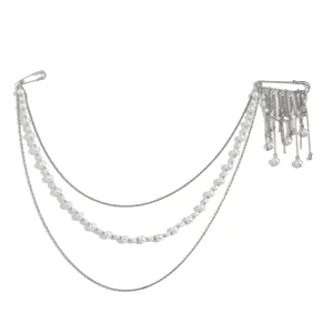 Detail of silver tassel brooch with multi-layered pearl chains and dual pins