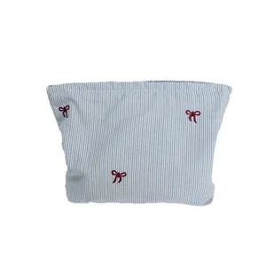 Blue and white striped makeup bag with red bow embroidery for women