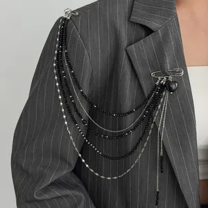 Punk style silver brooch with black heart charm and layered chain tassels for suits