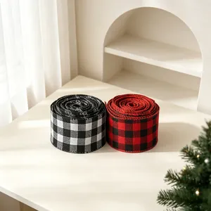 Close-up of red, black and white buffalo plaid ribbons for Christmas gift wrapping