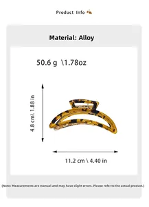 Detailed view of the hollow crescent metal claw clip with dimensions 11.2cm x 4.8cm