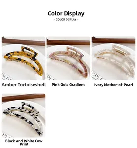 Hollow crescent metal hair claw clips in tortoise, pink gold, cream, and cow patterns