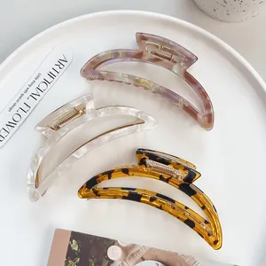 Three hollow crescent hair claws in purple marble, white crackle and amber leopard print