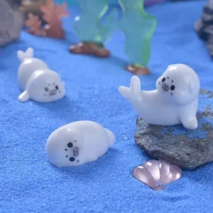 Three mini resin sea lion figurines for aquarium landscaping and desktop DIY decor
