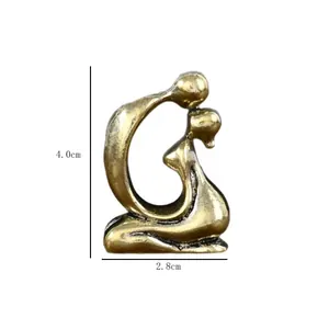 Macro shot of vintage brass couple statue with dimensions 4.0cm height and 2.8cm width