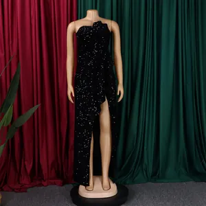 Detail of elegant black sequin off-shoulder evening dress with a high side slit design