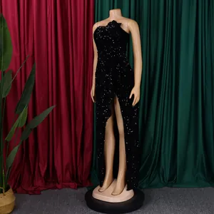 Detail of elegant black sequin evening gown featuring high slit and slim fit cut