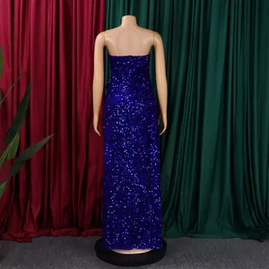 Close-up of the royal blue sequin fabric texture on an elegant off-shoulder evening gown