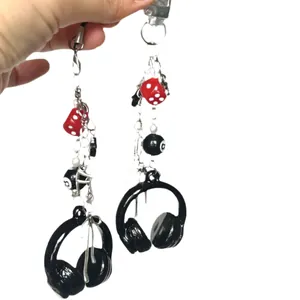 Cool street style keychain with black headphone charm, red dice, and number 8 ball