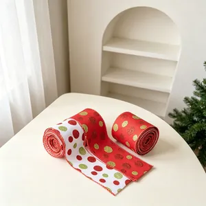 Detail of Christmas wired ribbons with sparkling glitter polka dots for gift wrapping