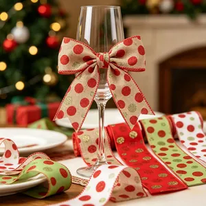 Polka dot Christmas ribbons with gold glitter tied in a bow on a glass in cozy setting