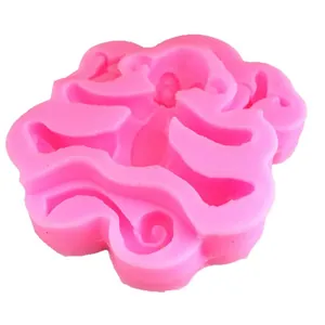 Pink silicone mold with intricate floral relief for cake decorating and DIY baking