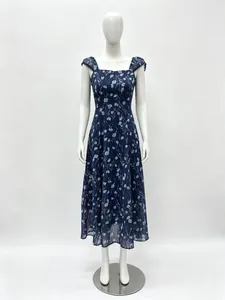 Close-up of floral print patterns on the navy blue fabric of this vintage sundress
