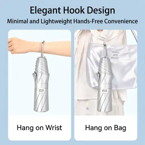 Portable silver folding umbrella with curved hook handle and UPF 50 sun protection