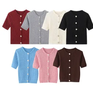 Detail of cable knit texture and buttons on slim fit short sleeve cardigans in various colors