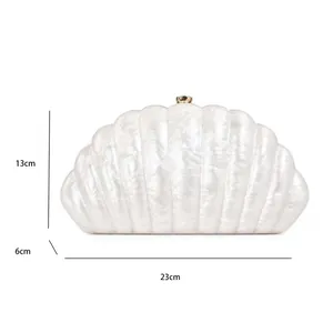 Shell-shaped acrylic evening bag size guide: 23cm length, 13cm height, 6cm depth
