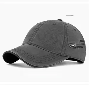 Detail of gray washed cotton baseball cap with embroidered WKAER text and side patches