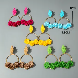 Detailed size measurement of colorful raffia flower earrings in a bohemian style