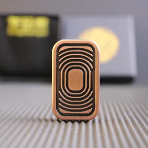 Macro detail of bronze metal fidget slider featuring concentric textured grooves