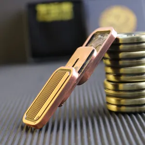 Macro shot of tiered copper EDC fidget slider with textured anti-slip stripes