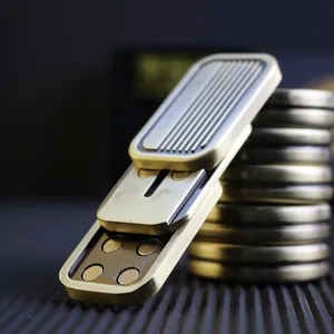 Macro view of the magnetic slider EDC toy showing internal magnets and brass texture
