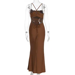 Detail of cross-back tie straps and backless design on brown satin knit dress