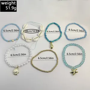 Detailed set of 7 bohemian shell and starfish beaded bracelets and shell necklace