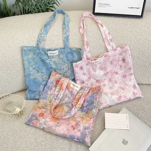 Detailed texture of floral lace tote bags with rustic fringe and woven labels