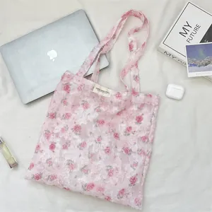 Pink floral tote bag with 3D textured embroidery and long shoulder straps
