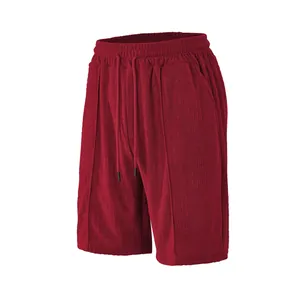 Men's burgundy sports shorts with waffle knit texture and drawstring elastic waist