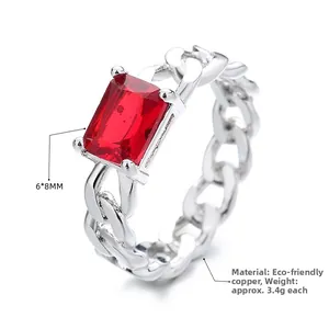 Macro shot of silver chain ring featuring a 6x8mm rectangle red cubic zirconia stone